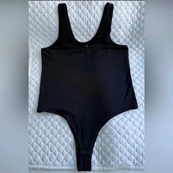 ATM Black Bodysuit One Piece with High-Cut Leg Openings