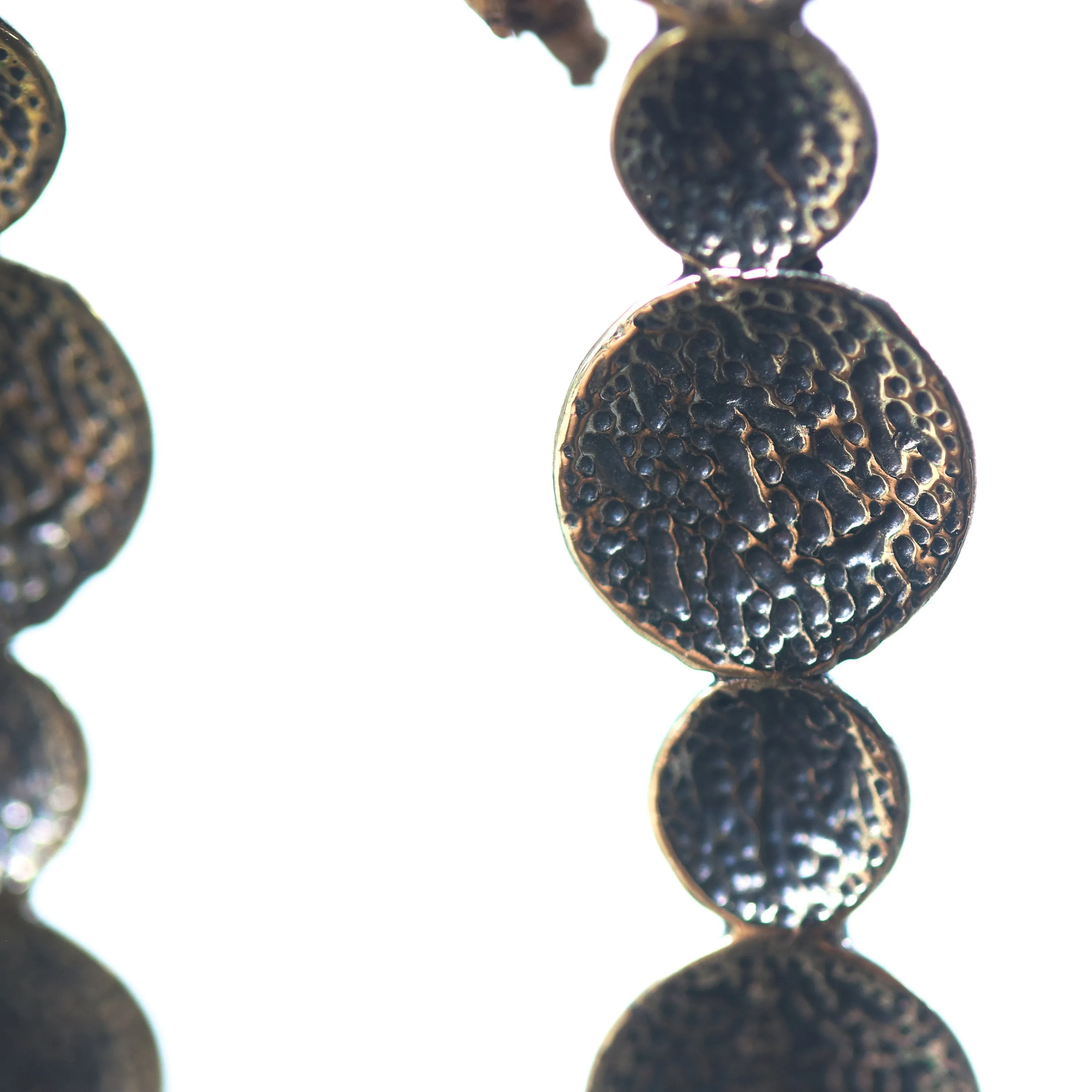 Brass circle earrings with texture oxidized on sterling silver post style