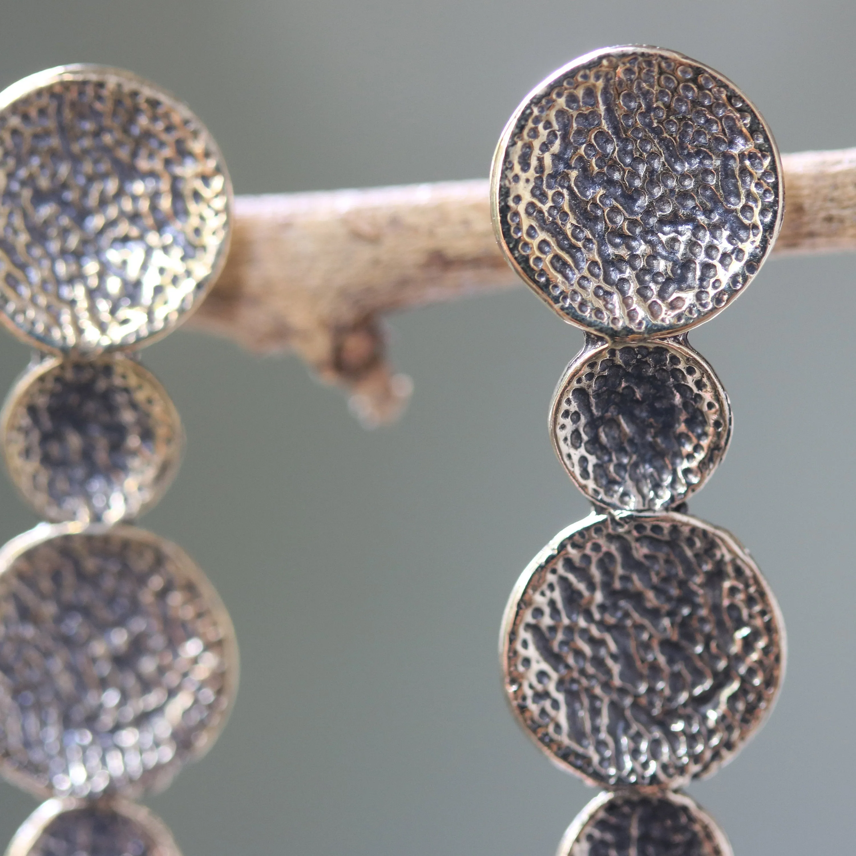 Brass circle earrings with texture oxidized on sterling silver post style
