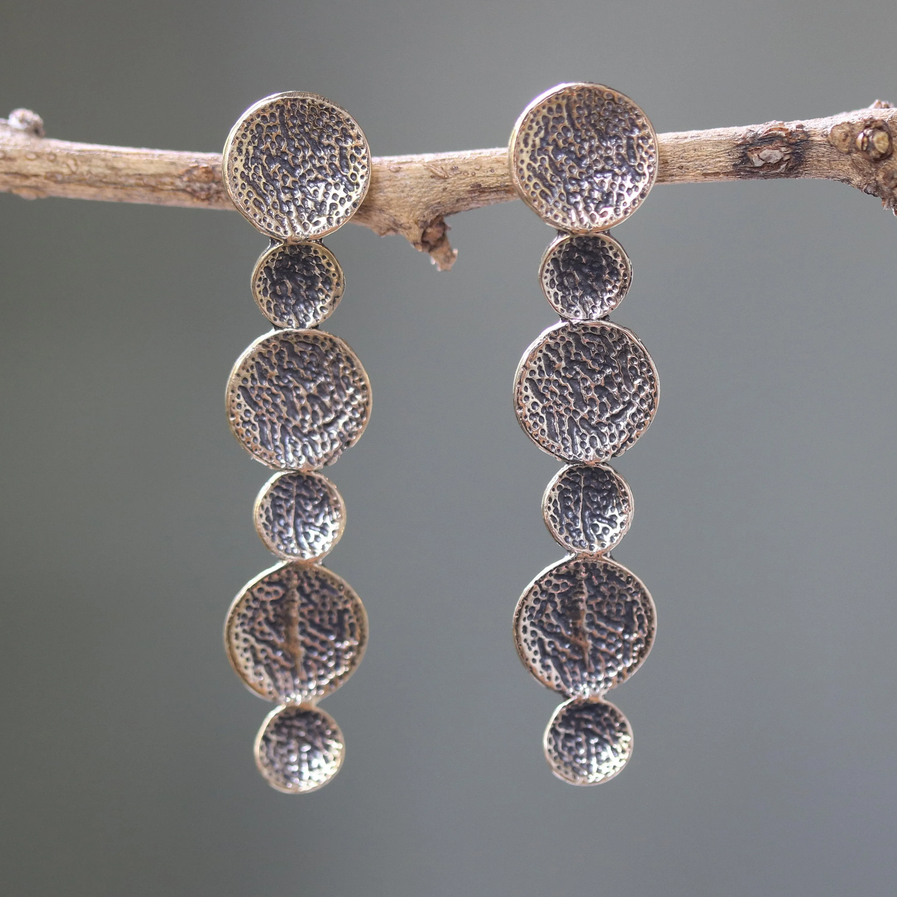 Brass circle earrings with texture oxidized on sterling silver post style