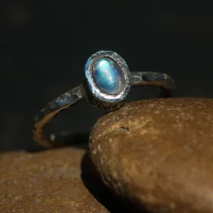 Dainty oval moonstone ring in silver bezel setting with oxidized texture sterling silver band