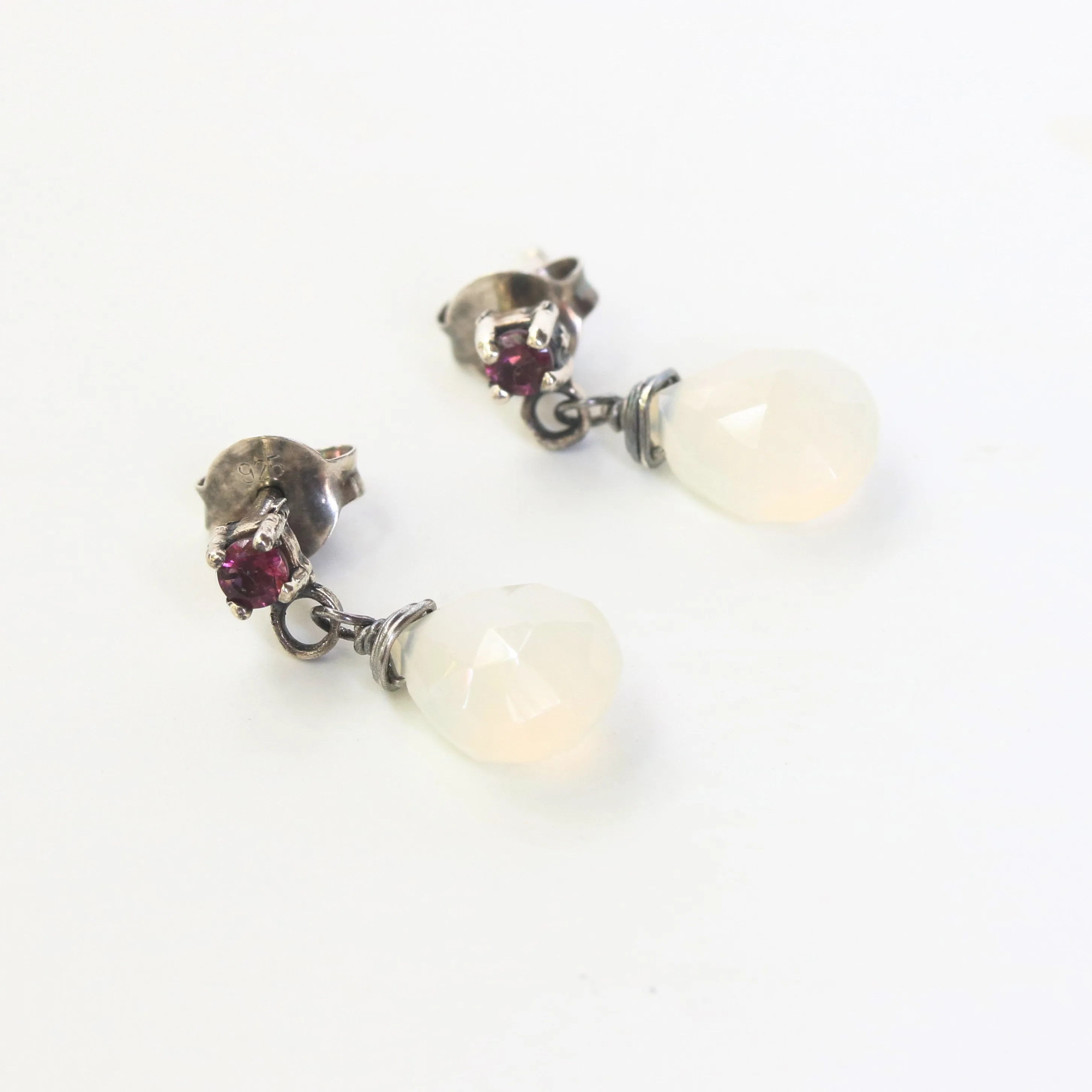 Dyed white chalcedony teardrop faceted earrings with tiny pink tourmaline on the top and sterling silver stud style
