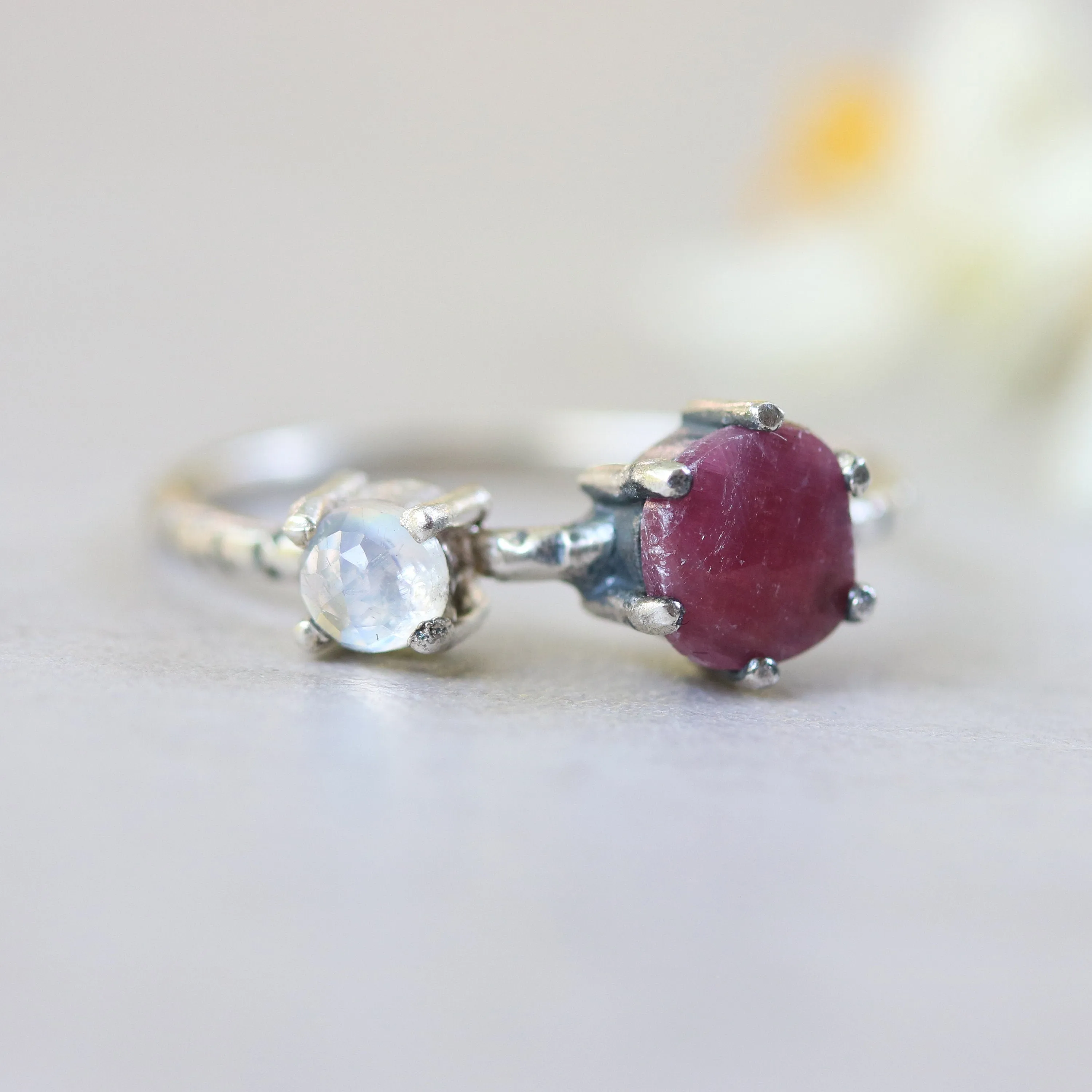 Faceted ruby ring in silver prongs setting and faceted moonstone with sterling silver texture band