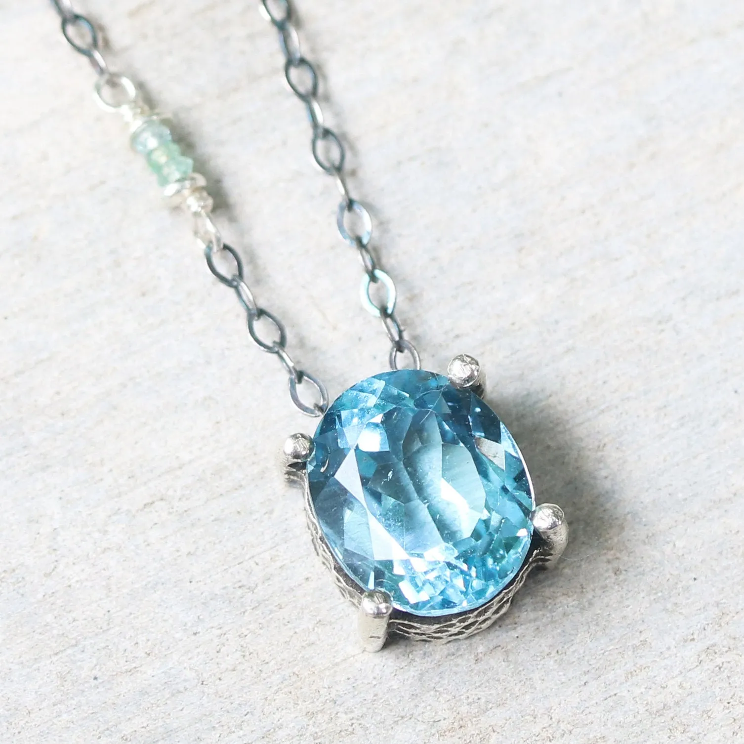 Oval Blue topaz pendant necklace in silver bezel and prongs setting with aquamarine beads secondary on oxidized sterling silver chain
