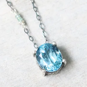 Oval Blue topaz pendant necklace in silver bezel and prongs setting with aquamarine beads secondary on oxidized sterling silver chain