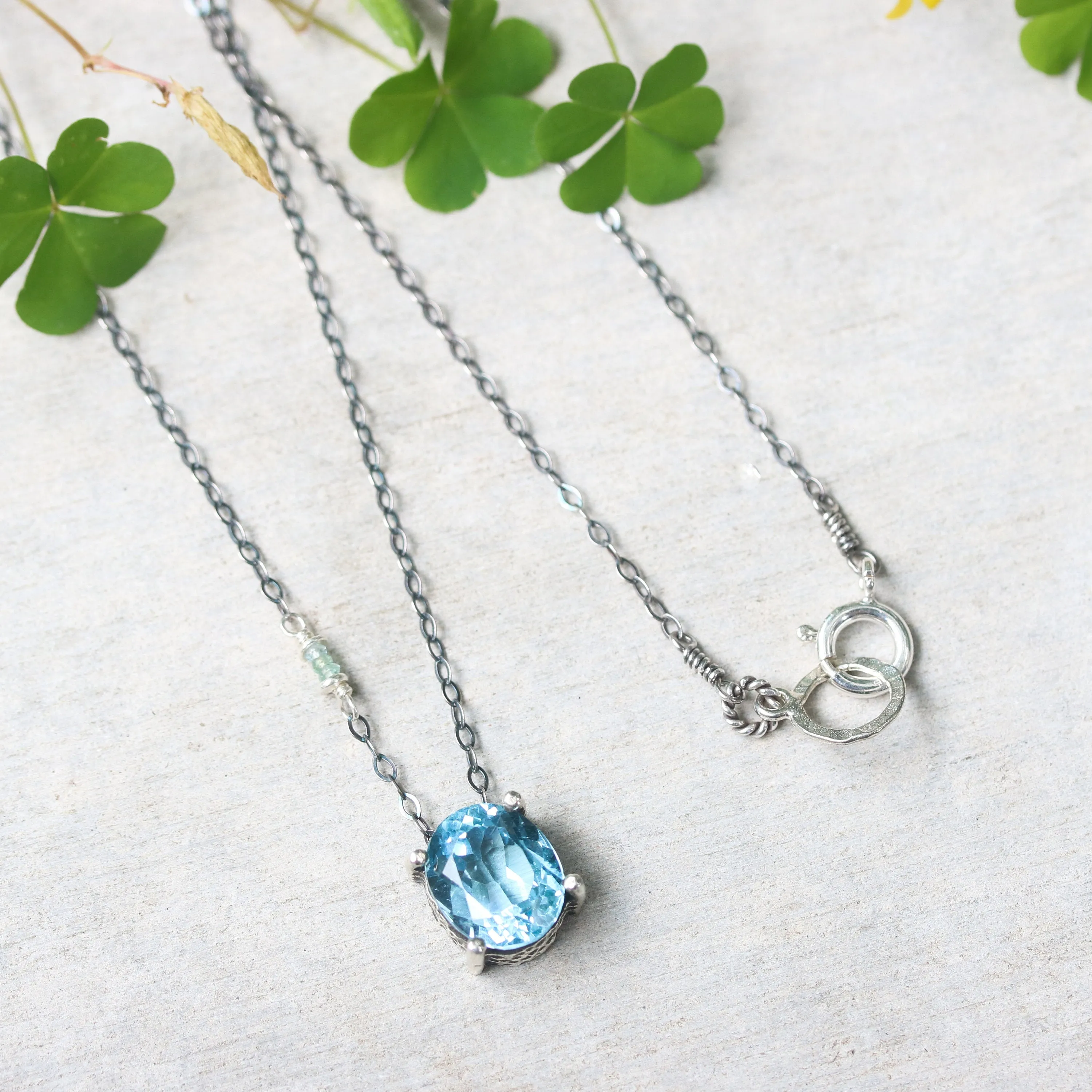 Oval Blue topaz pendant necklace in silver bezel and prongs setting with aquamarine beads secondary on oxidized sterling silver chain