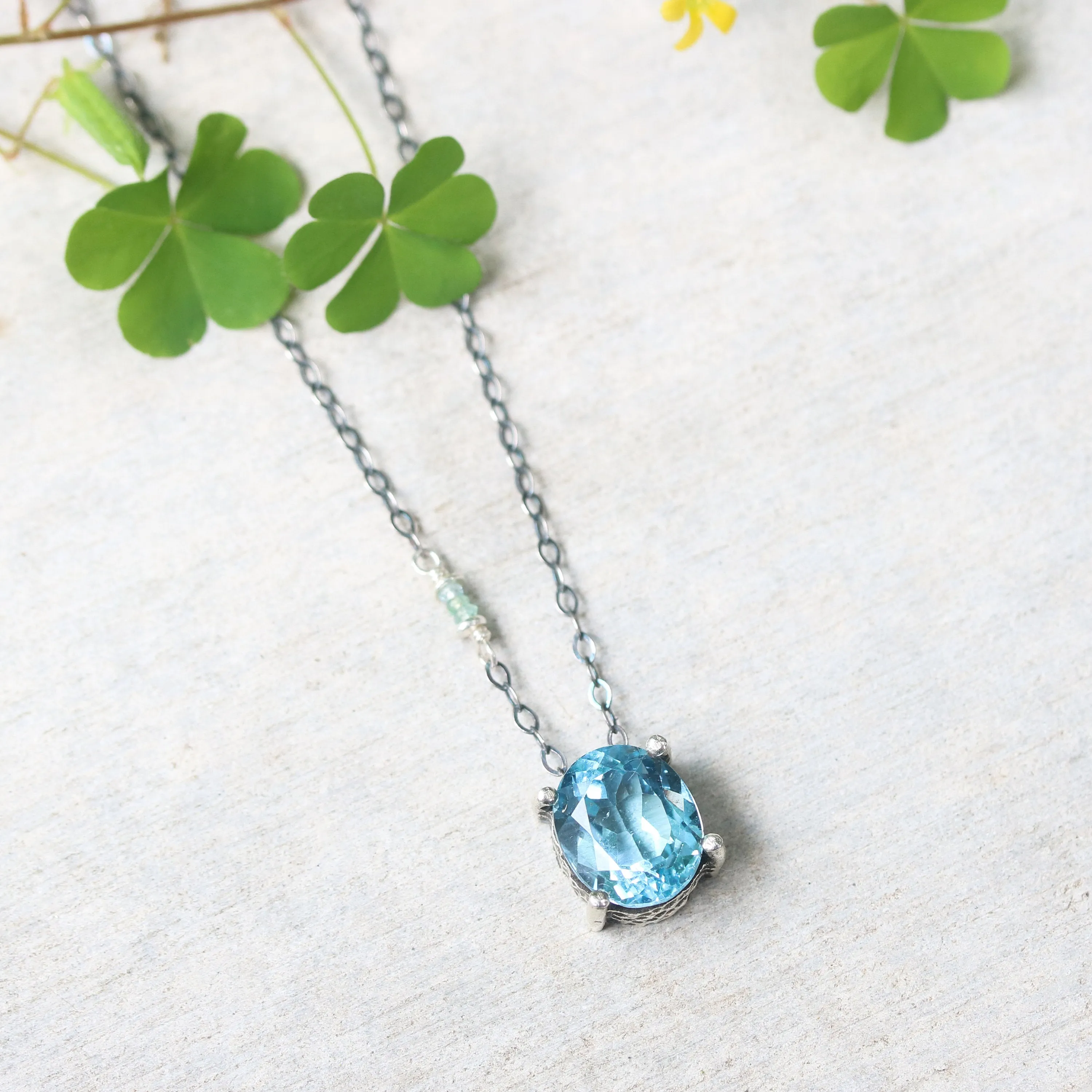 Oval Blue topaz pendant necklace in silver bezel and prongs setting with aquamarine beads secondary on oxidized sterling silver chain