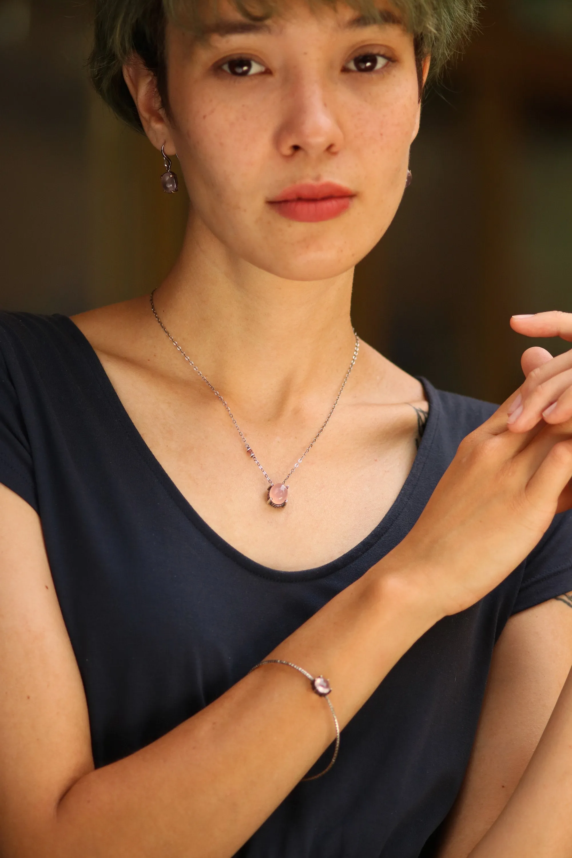 Oval cabochon rose quartz necklace in silver bezel and prongs setting with pink multi-sapphire beads secondary on oxidized silver chain