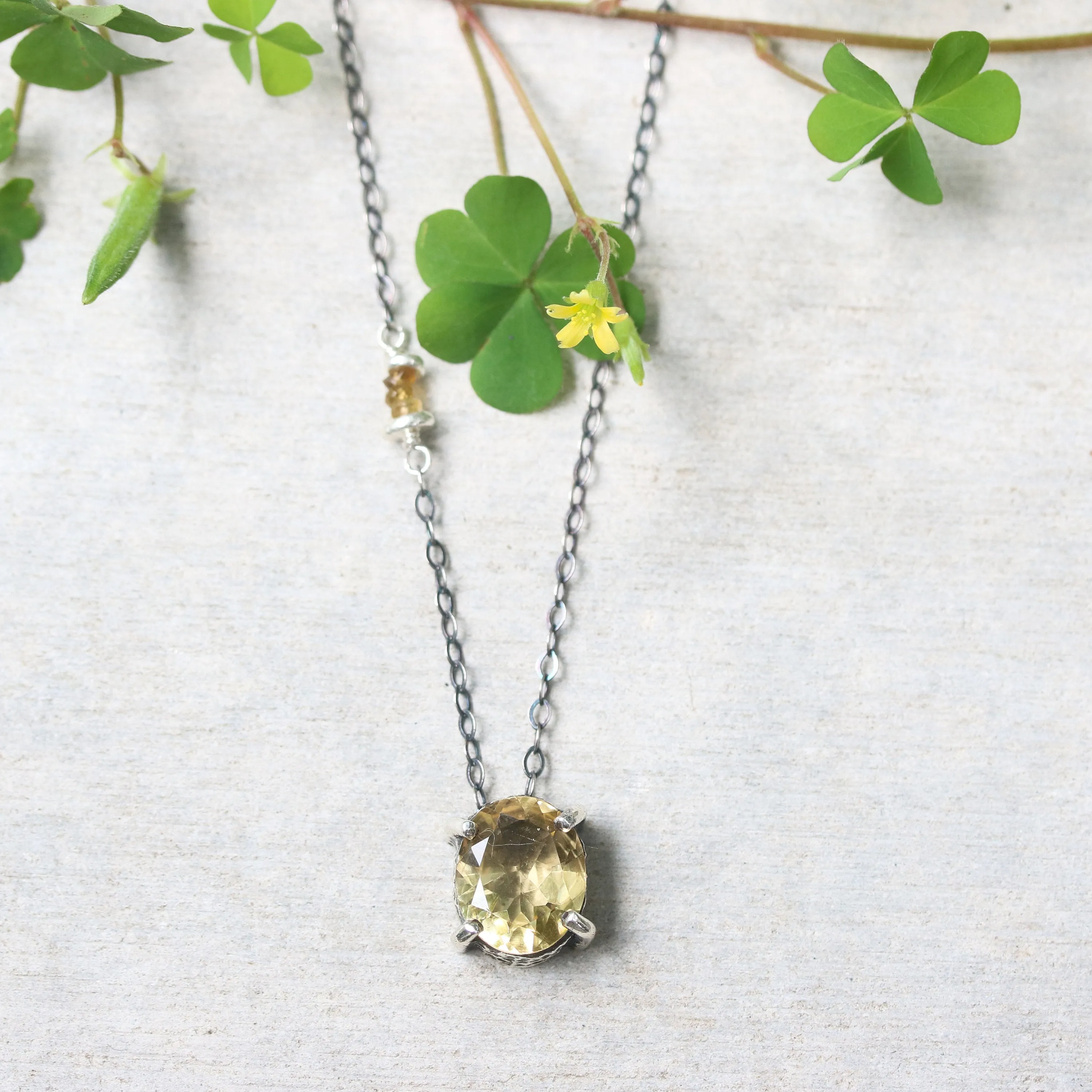 Oval faceted Citrine pendant necklace in silver bezel and prongs setting with yellow multi-sapphire beads secondary on silver chain