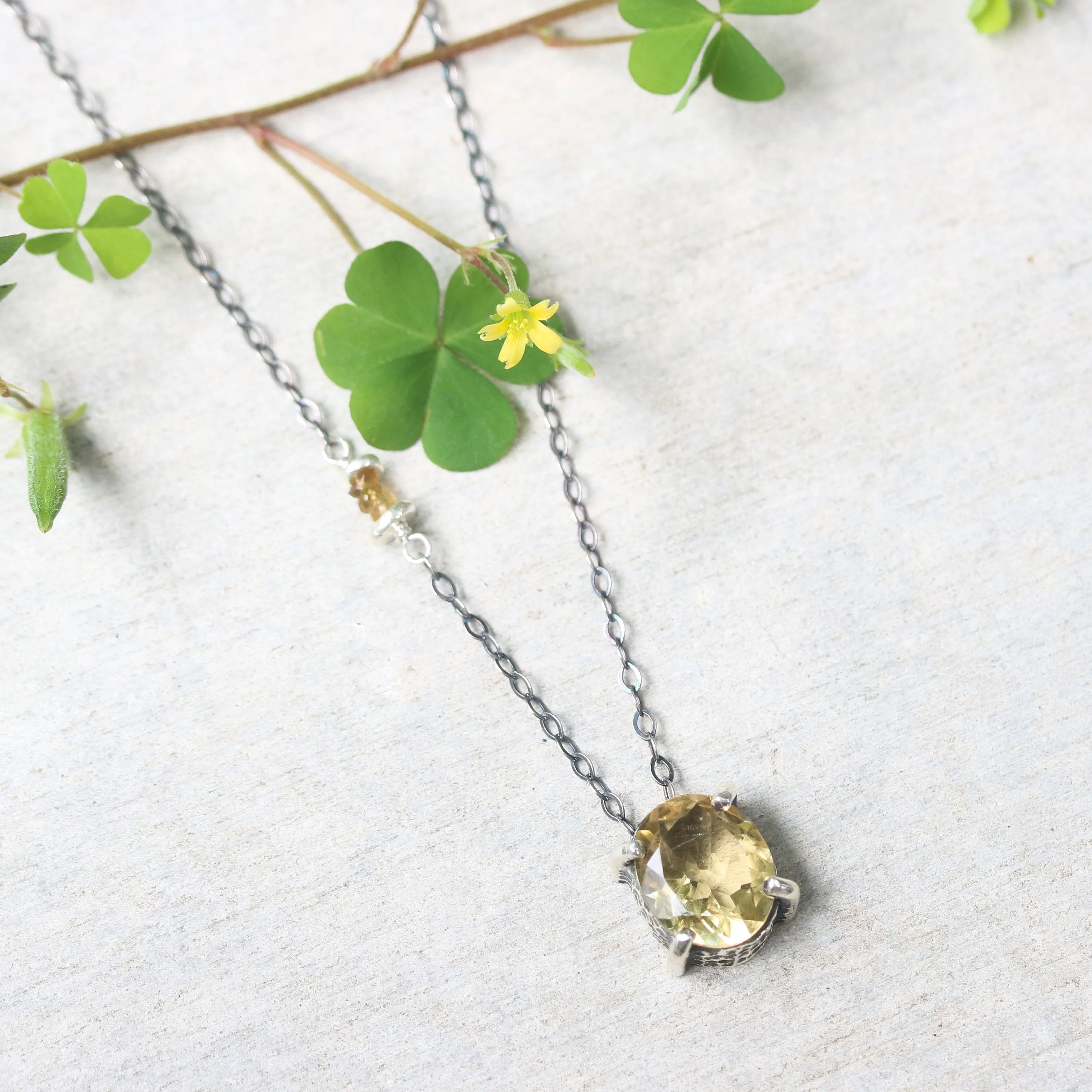 Oval faceted Citrine pendant necklace in silver bezel and prongs setting with yellow multi-sapphire beads secondary on silver chain