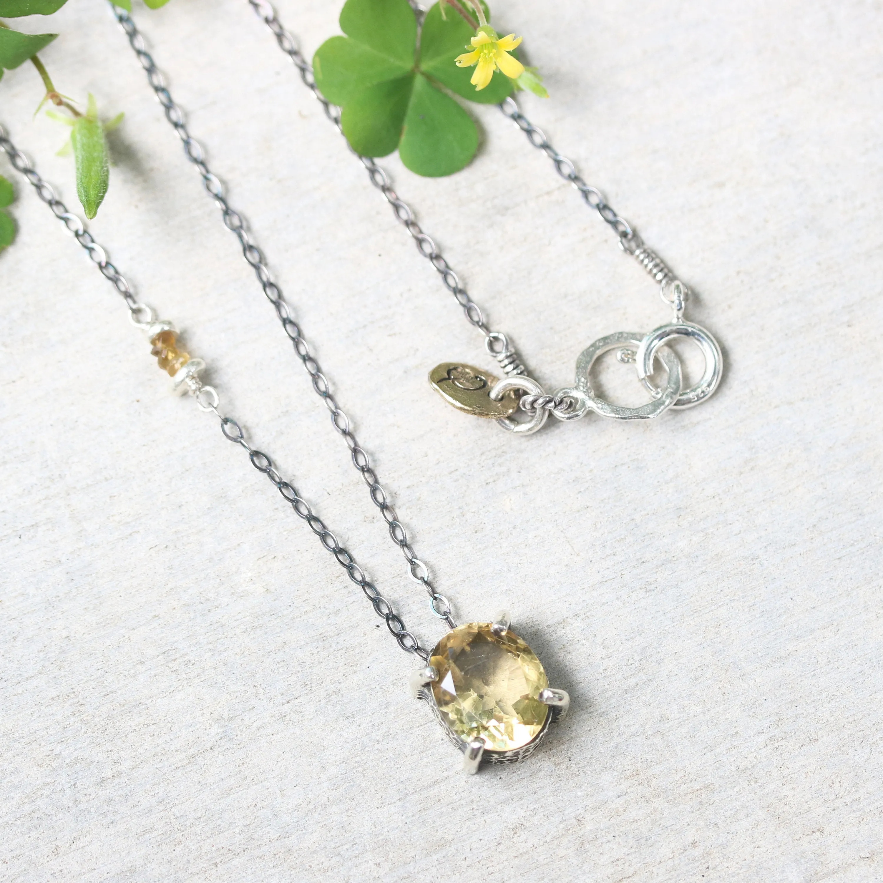 Oval faceted Citrine pendant necklace in silver bezel and prongs setting with yellow multi-sapphire beads secondary on silver chain