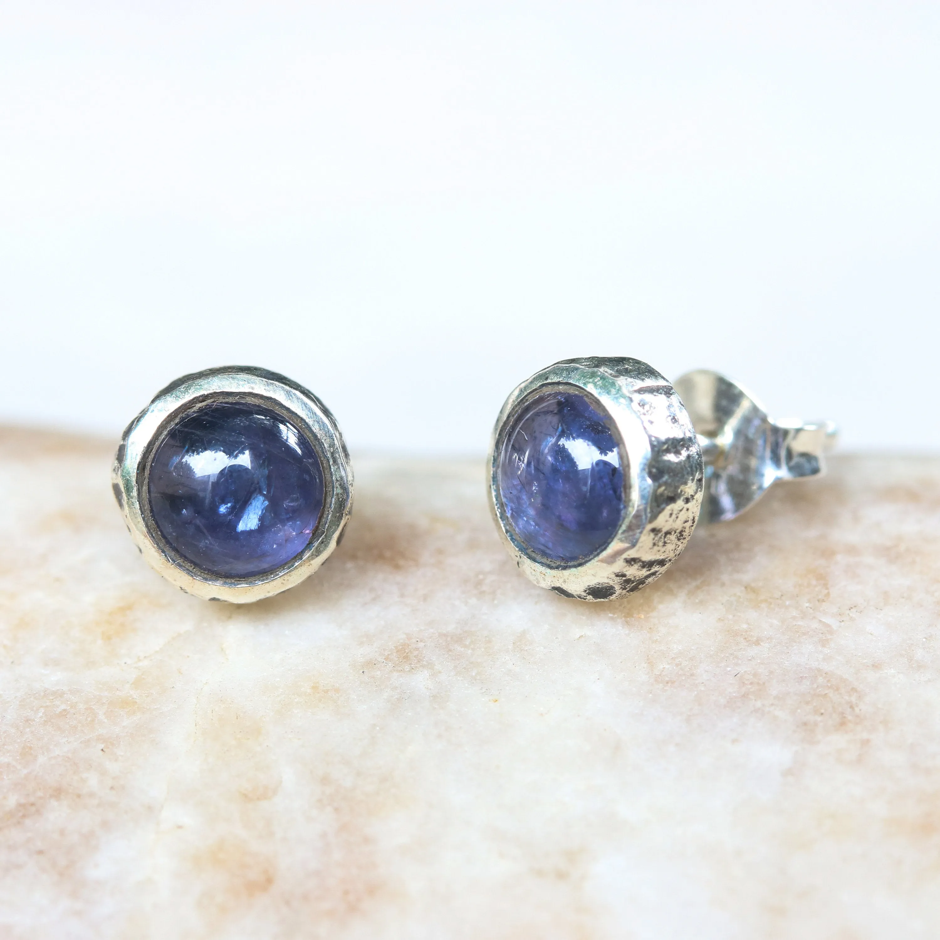 Round cabochon Iolite earrings in silver bezel setting with sterling silver post and backing