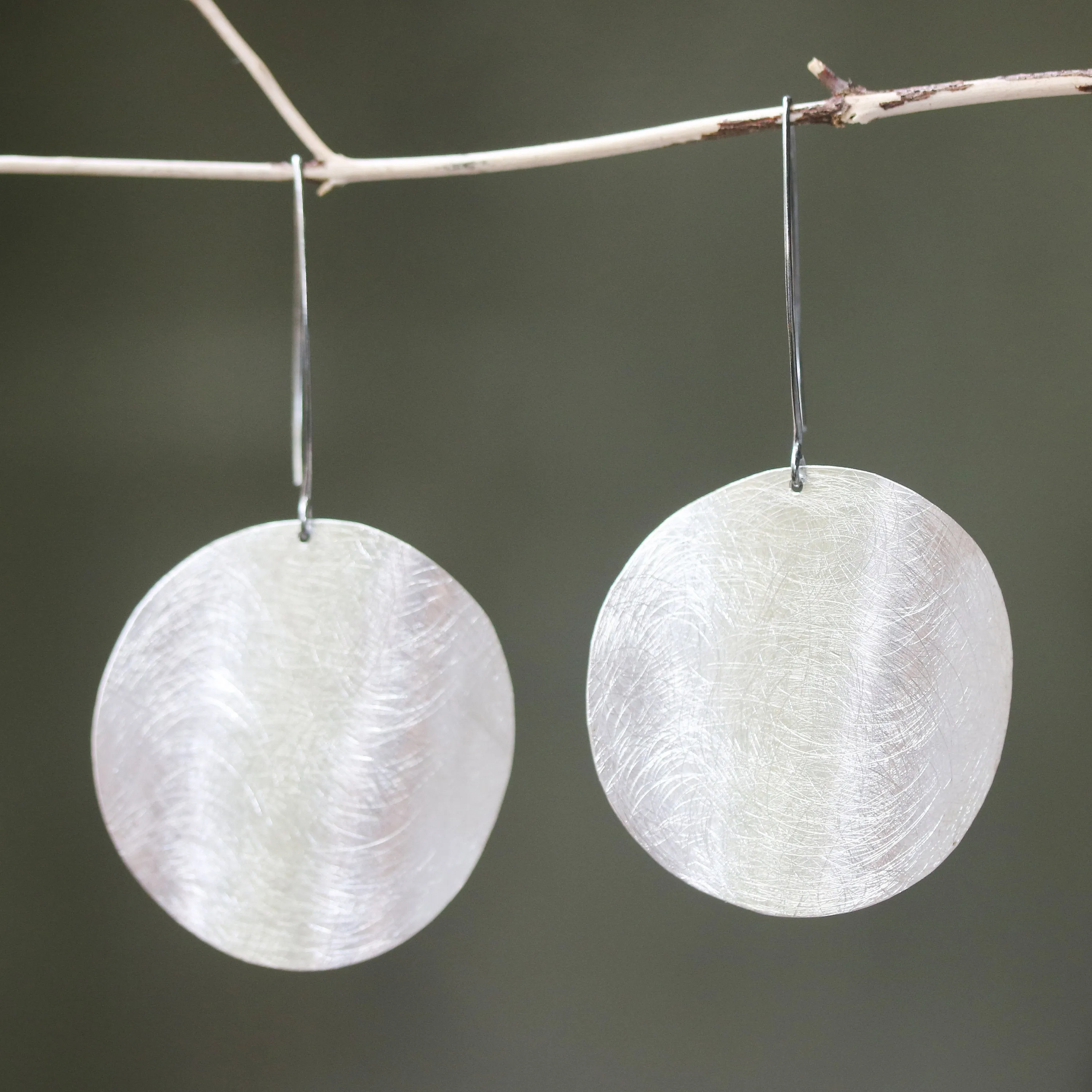Silver circle earrings with scratched technique texture on sterling silver marquise ear wires hook style