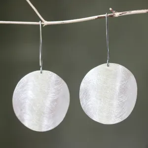 Silver circle earrings with scratched technique texture on sterling silver marquise ear wires hook style