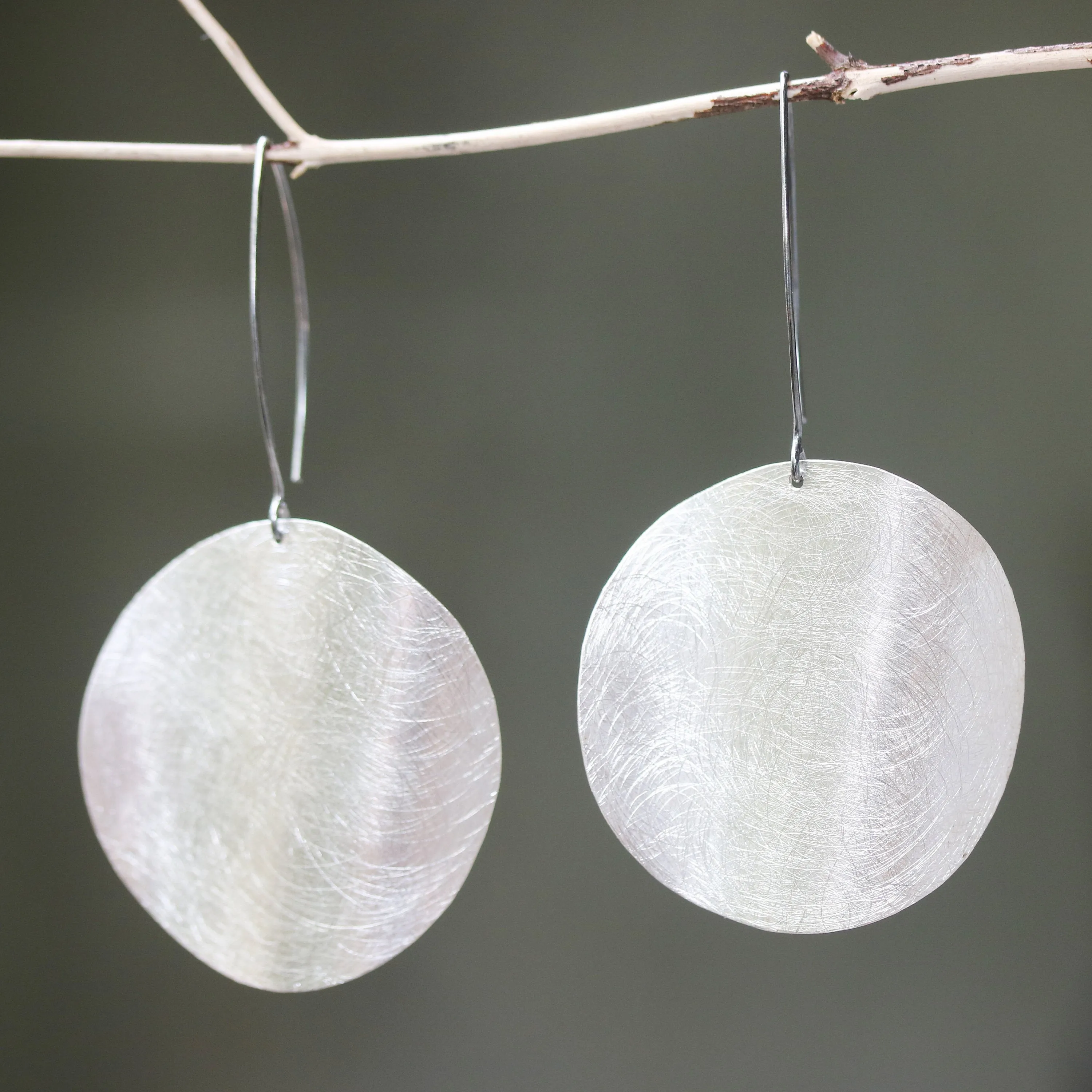 Silver circle earrings with scratched technique texture on sterling silver marquise ear wires hook style