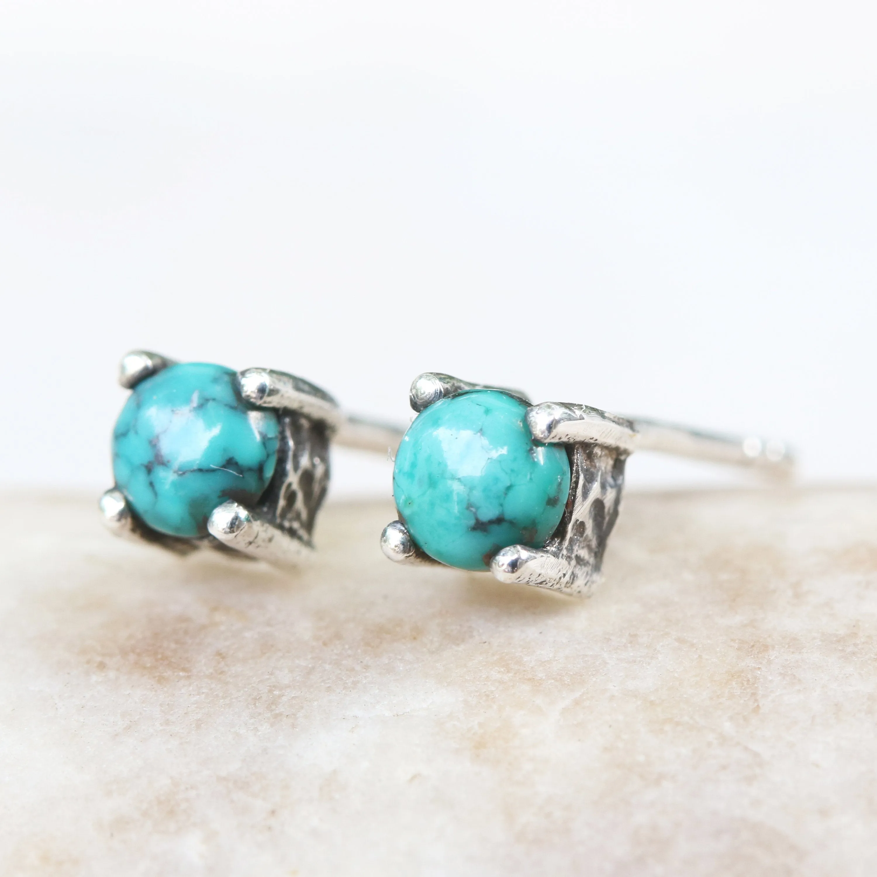 Sterling silver stud earrings with cabochon turquoise in prongs setting with sterling silver post and backing