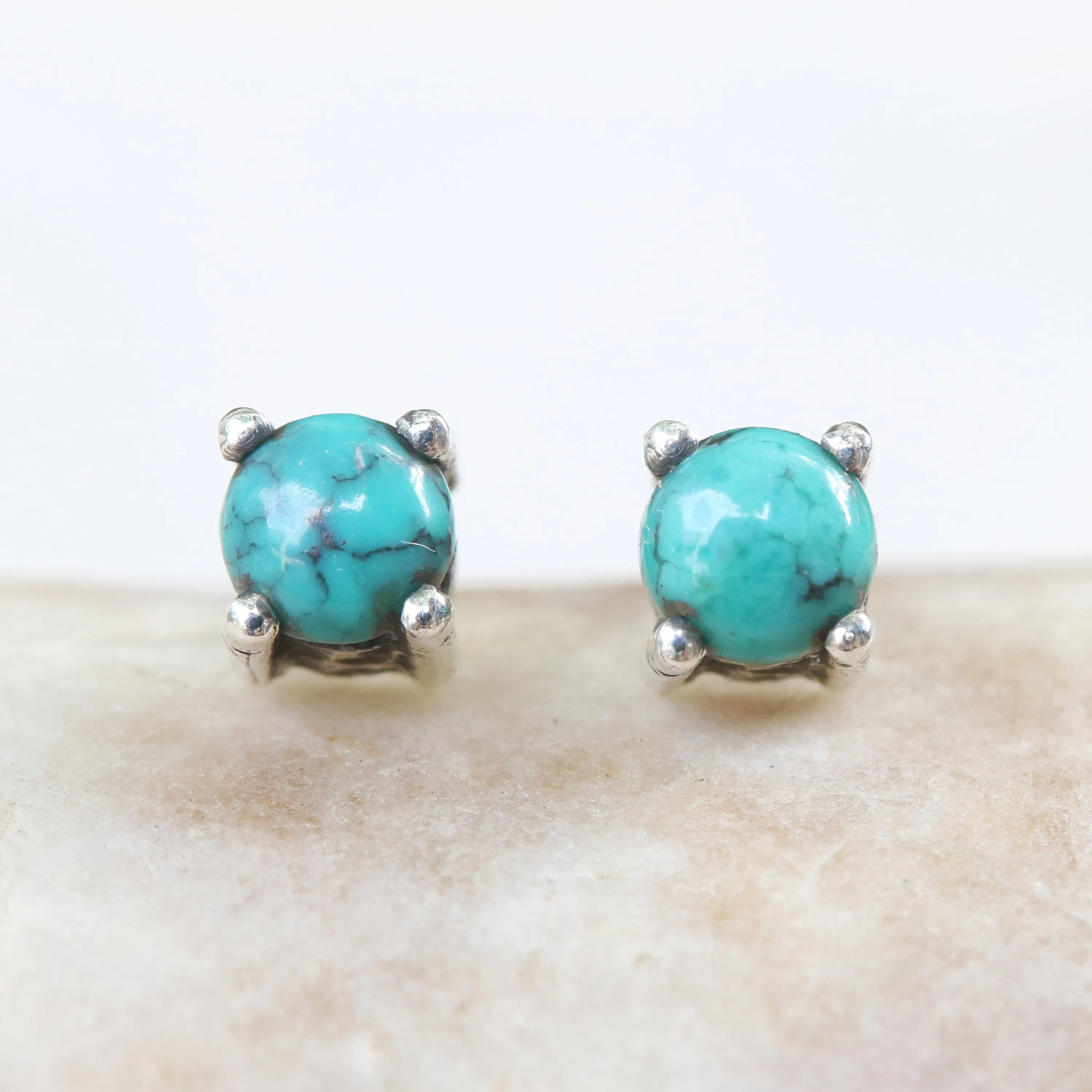 Sterling silver stud earrings with cabochon turquoise in prongs setting with sterling silver post and backing