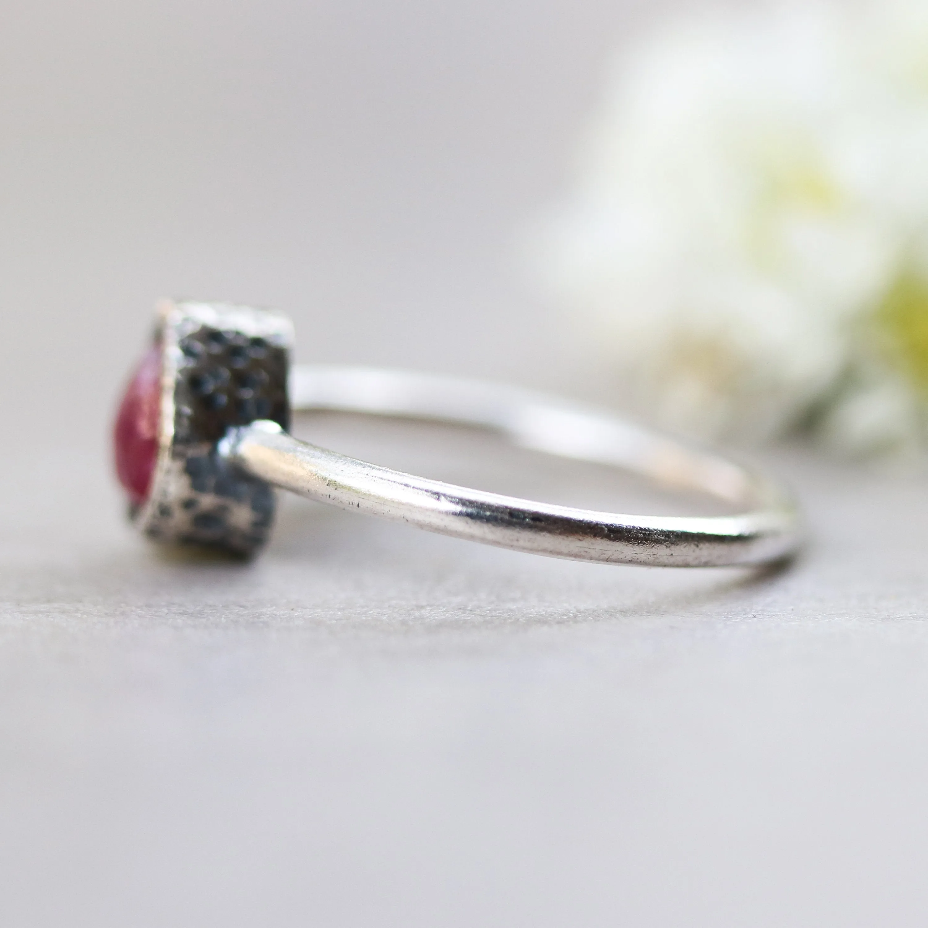 Teardrop ruby ring in silver bezel setting with sterling silver high polish finished band