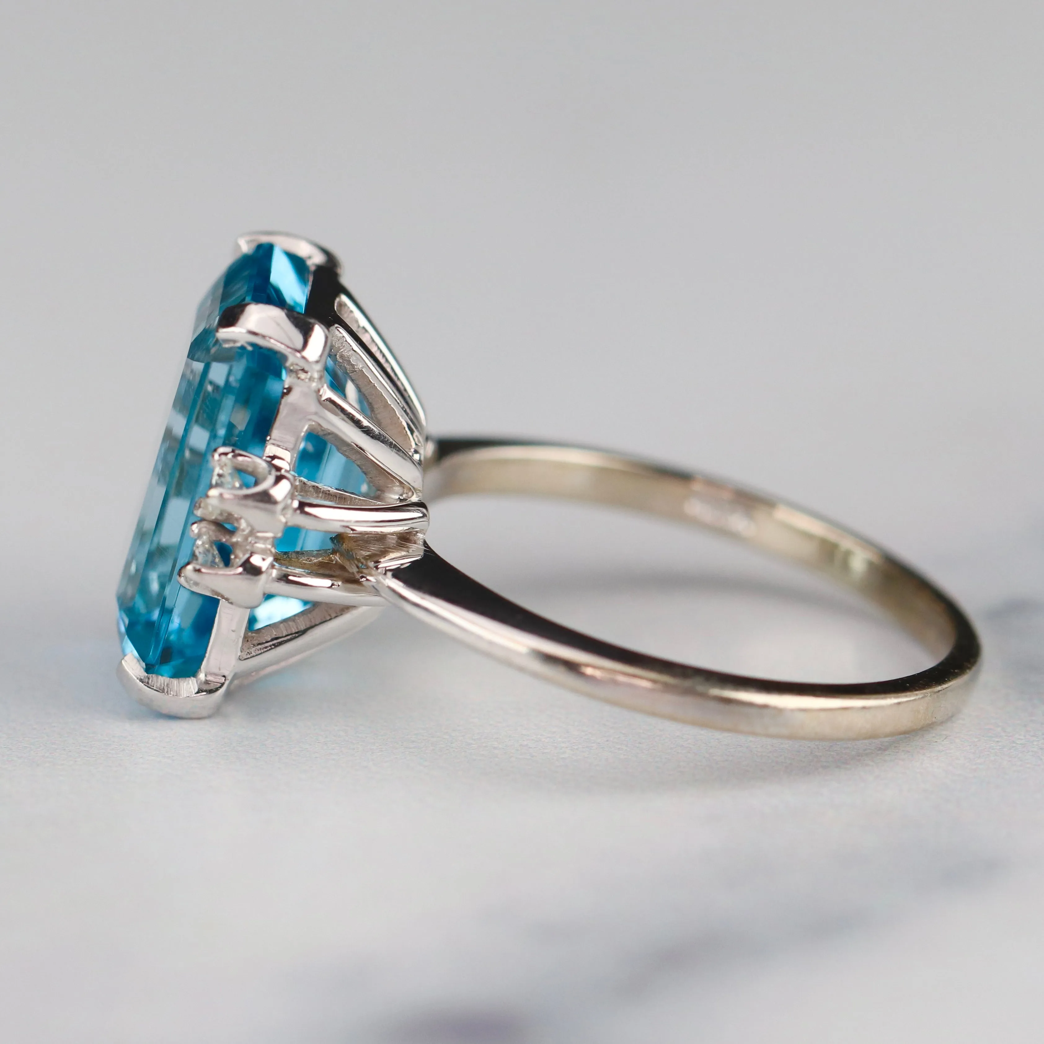 Vintage Emerald cut blue topaz and diamond ring in 14k white gold