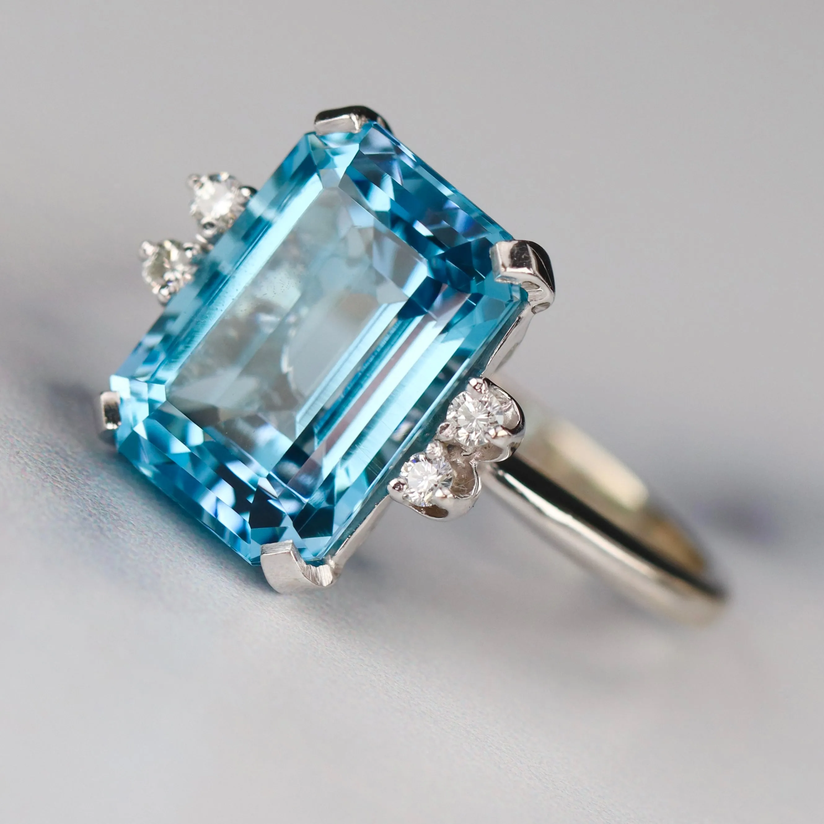 Vintage Emerald cut blue topaz and diamond ring in 14k white gold