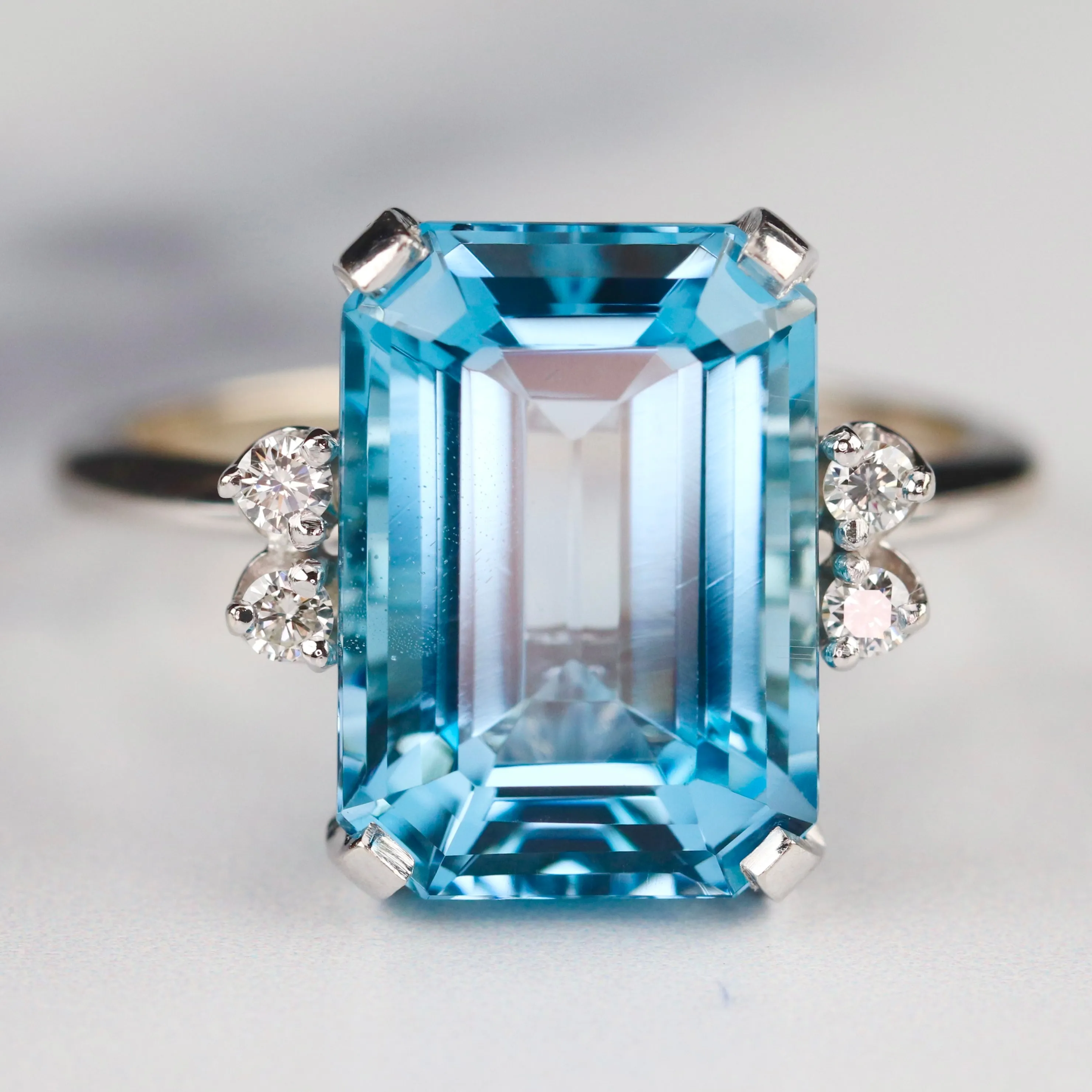Vintage Emerald cut blue topaz and diamond ring in 14k white gold