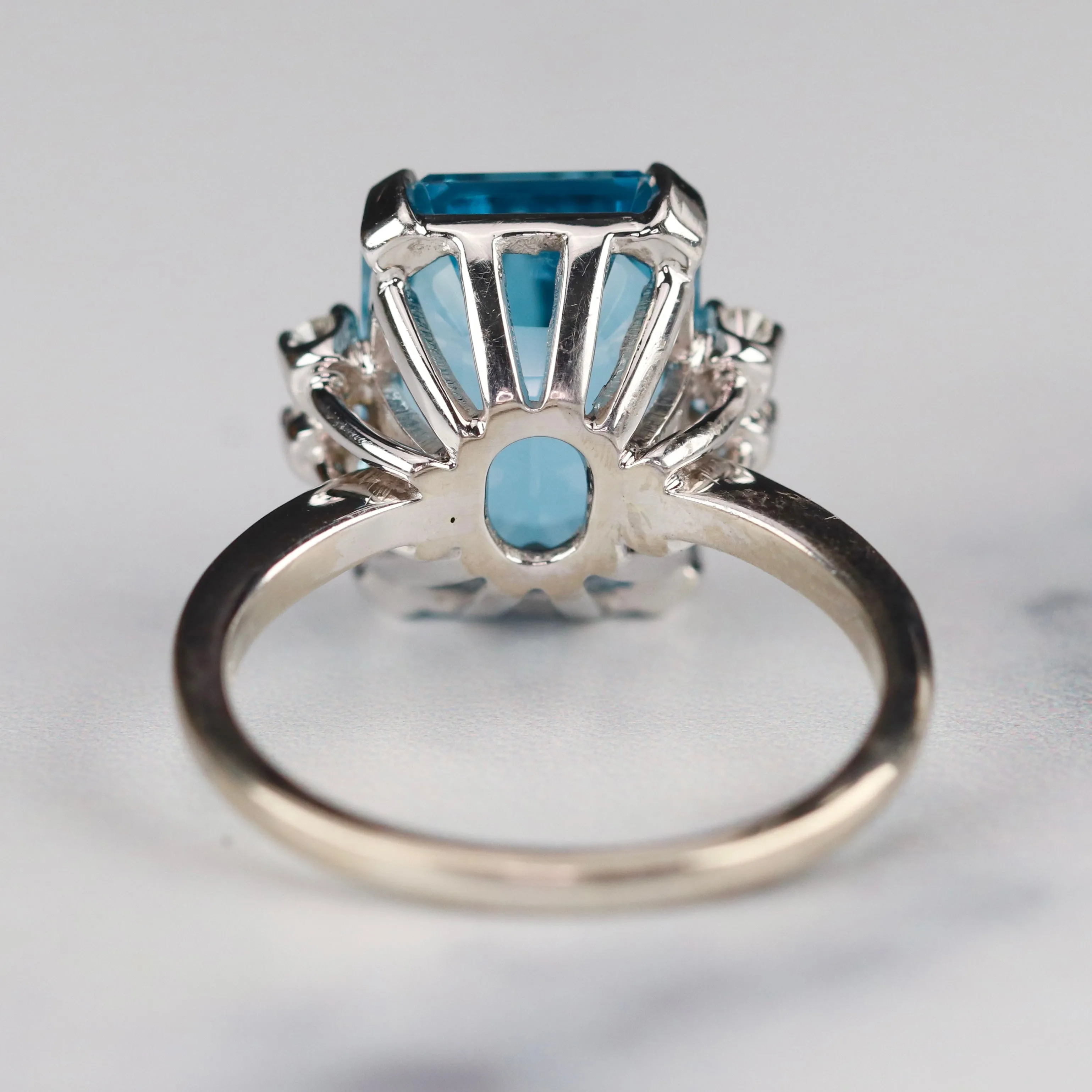 Vintage Emerald cut blue topaz and diamond ring in 14k white gold