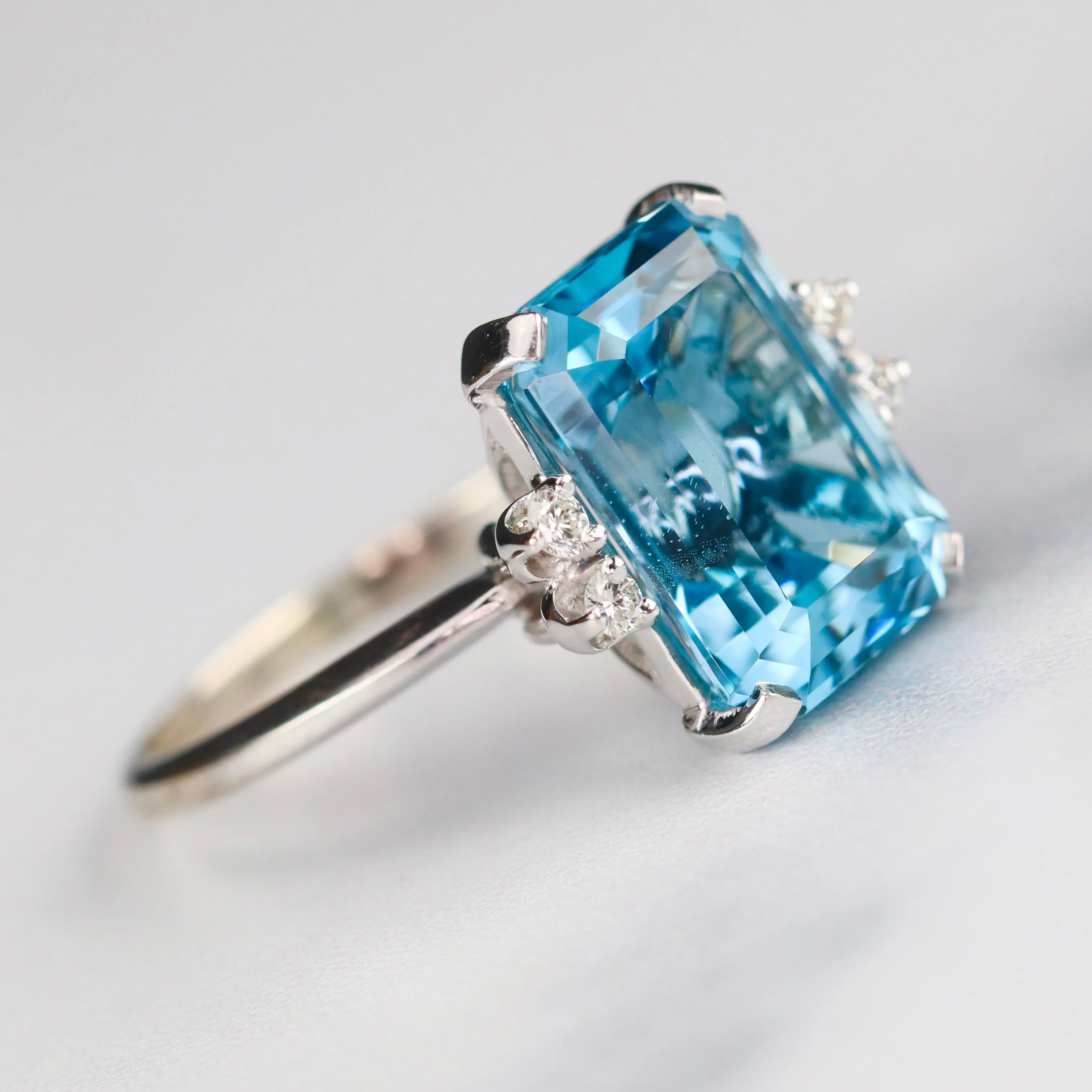 Vintage Emerald cut blue topaz and diamond ring in 14k white gold