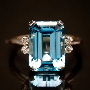 Vintage Emerald cut blue topaz and diamond ring in 14k white gold