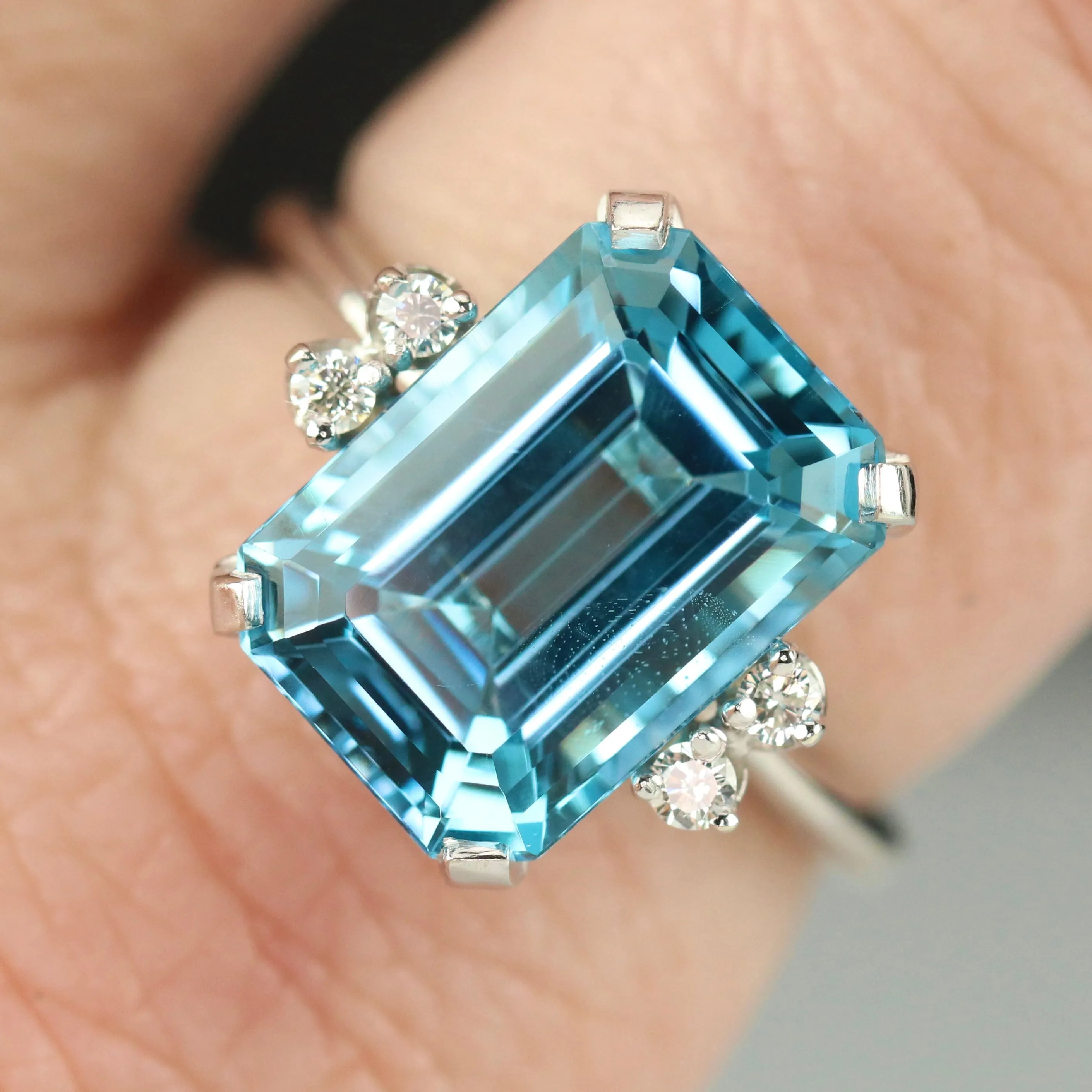 Vintage Emerald cut blue topaz and diamond ring in 14k white gold
