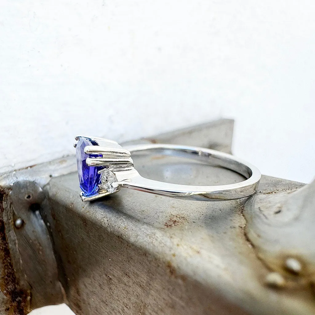 White Gold Double Claw Trilliant Cut Tanzanite With Diamond Shoulder Highlight Ring